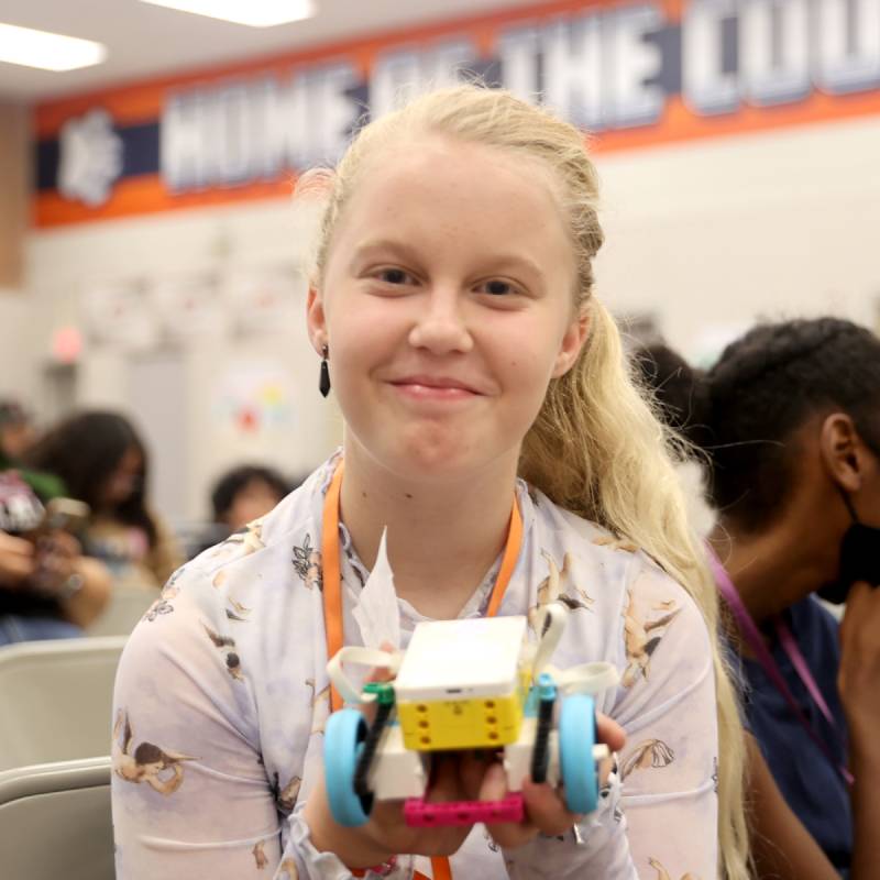 girl holding an rc car