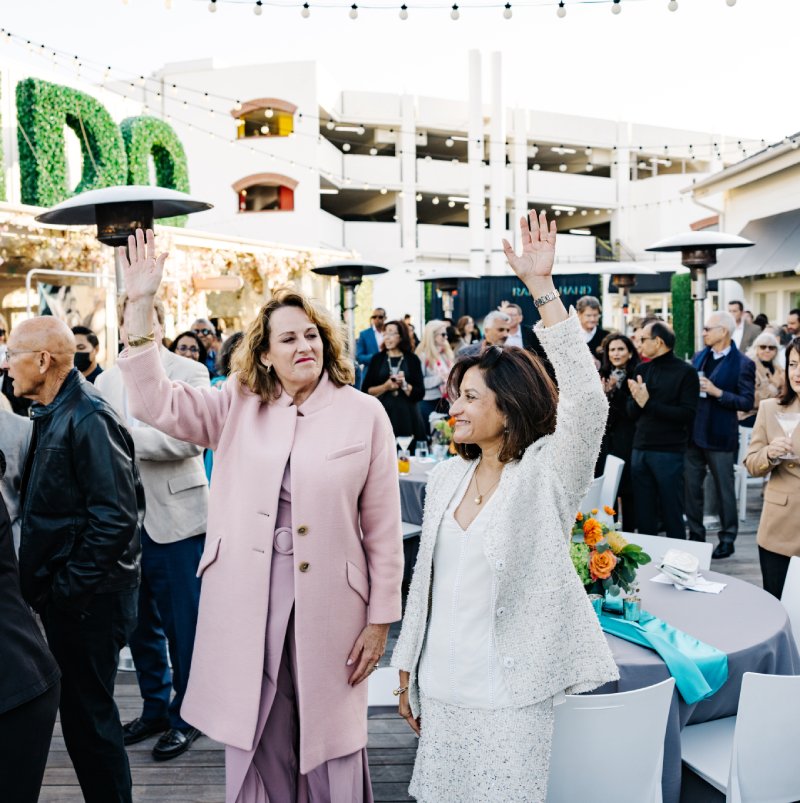 Leaders raise their hands for kids at the Raise A Hand reception at Lido Marina Village
