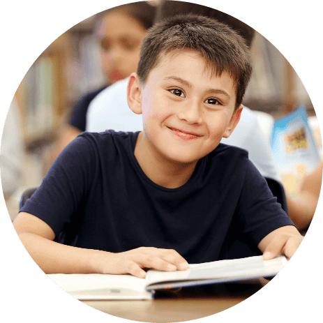 boy holding book smiling